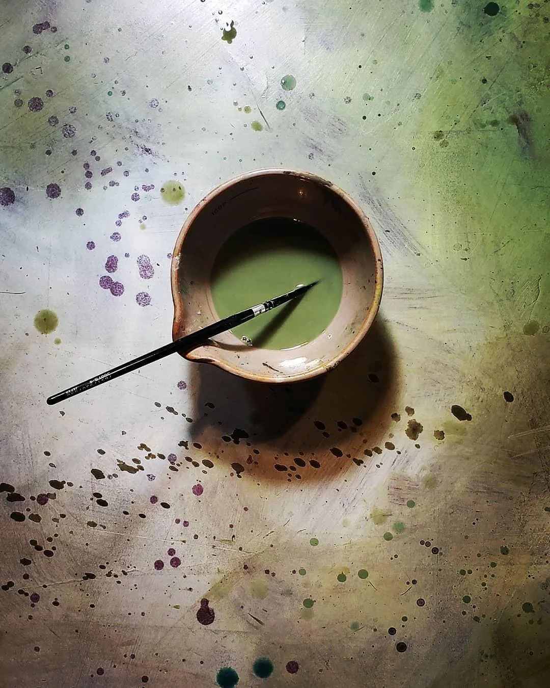 These images are a documented diary of the accumulation of oil colours cleansed from brushes. these are the final tints of turpentine from the daily painting in his studio. each photograph showcases the often overlooked processes of an artist. In each image one is allowed to see beauty in the incidental. .