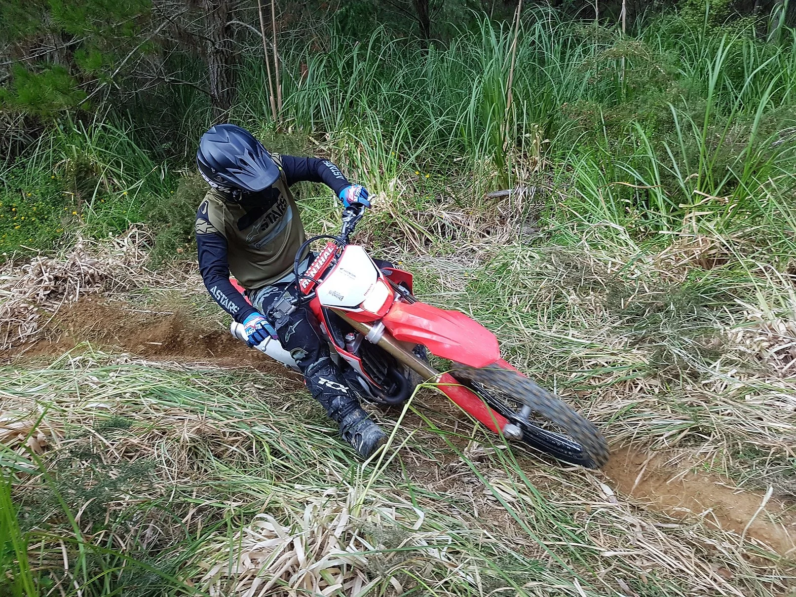 The CRF450RX performs well in the tighter terrain and handles well in a rut.
