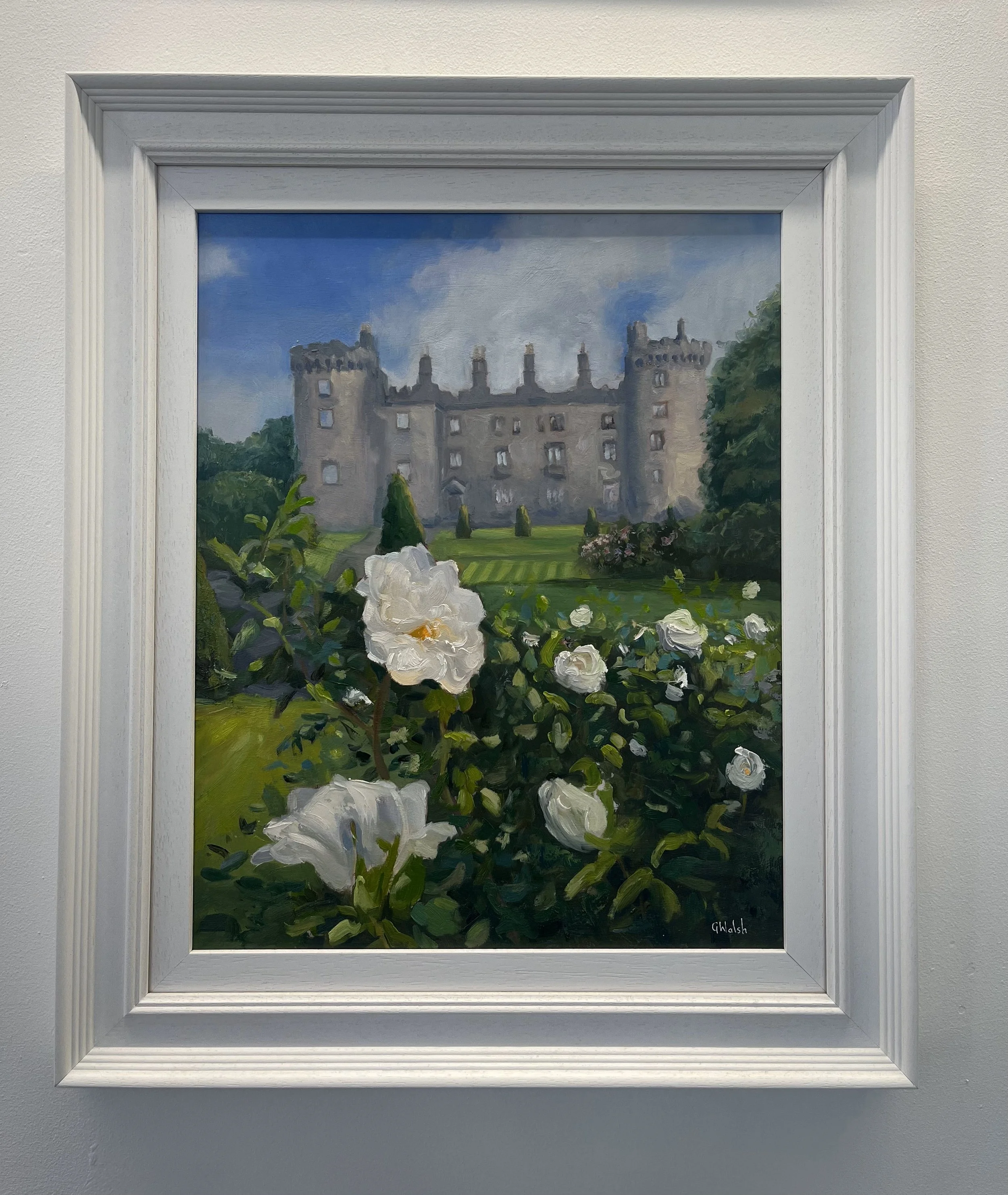 Close-up oil painting of white roses in bloom with the stone walls of Kilkenny Castle in the background.