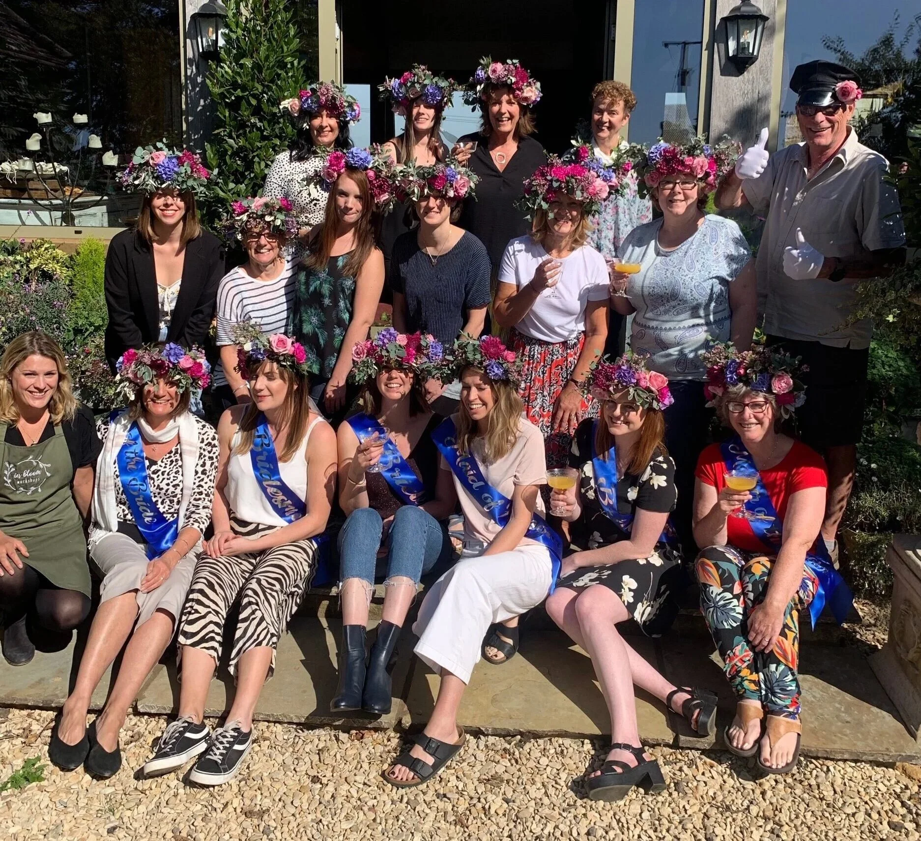 A hen party in flower crowns and sashes