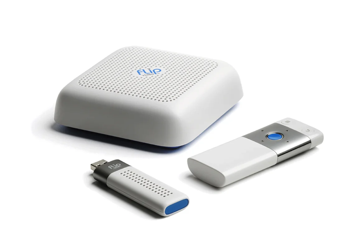  Flip share TV module with remote and computer dongle. The remote retained the iconic Flip center button familiar across the Flip family of products. The dongle was used to create a simple connection to the TV module and easily sync the videos from c