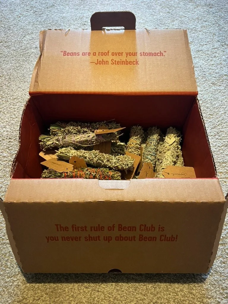 This picture makes me happy. Because it reminds me that I'm in a bean club - for real. I love it. And because my bean club box is filled with smoke bundles made with my own garden sages, lavenders, lemongrasses...plus mugwort and wormwood. So much lo