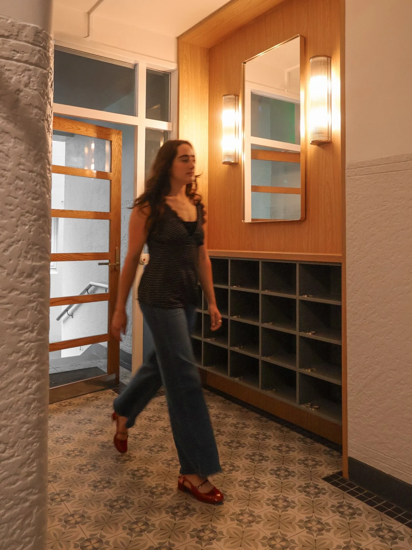 The ways in which CMID revived this apartment building lobby are numerous. Our interior design assistant Maya, catwalks across the new floor tiling with its handsome motif paying homage to the building&rsquo;s Art Deco heritage. 

Freshly painted, th
