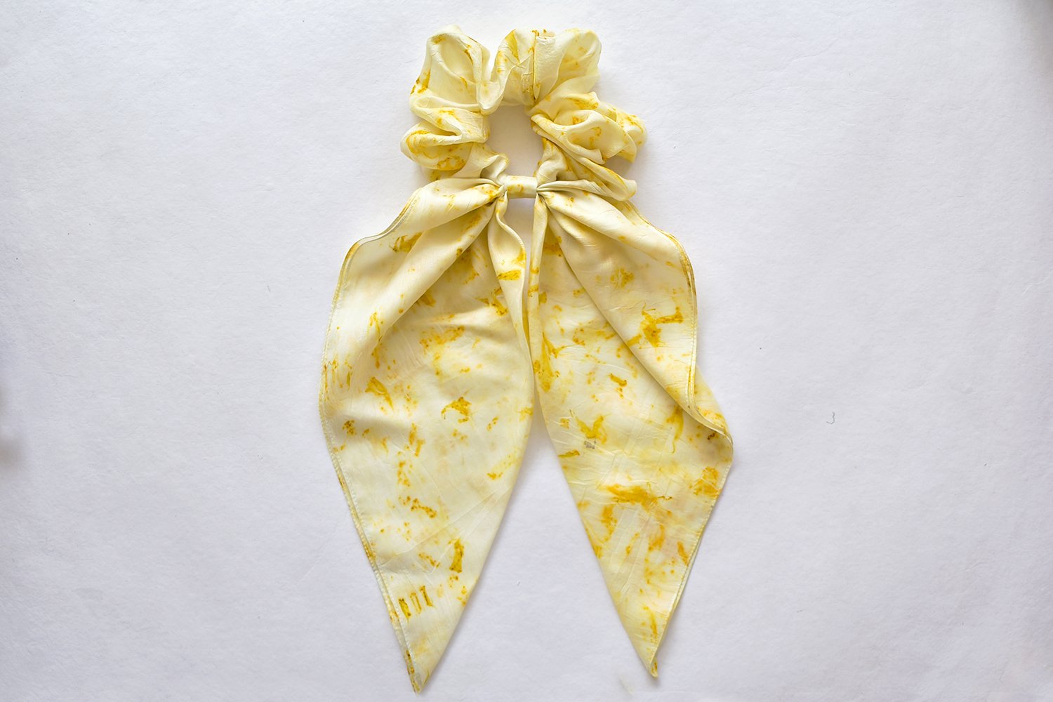 Nila scrunchie made by Adiv Pure Nature; mulberry silk printed with marigold petals. 