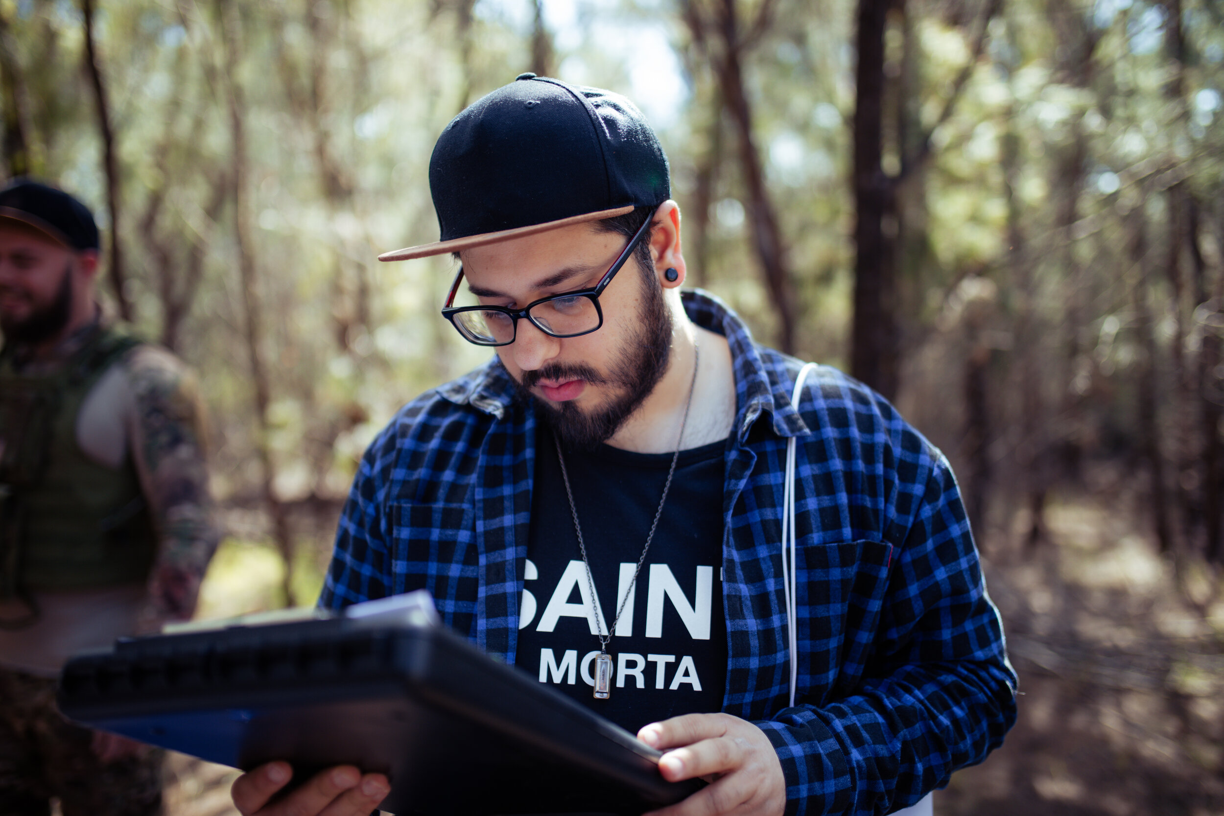 Matt revising his director's notes on the set of Snake Eyes' music video, "WARFARE" (2019)