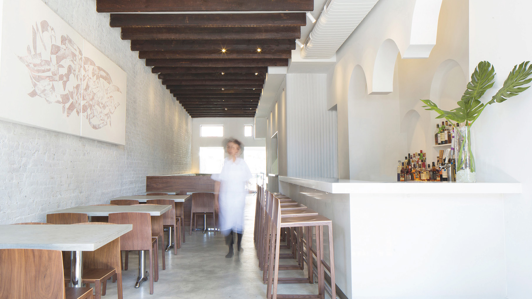 Silhouette of chef Nasim Alikhani inside Sofreh restaurant