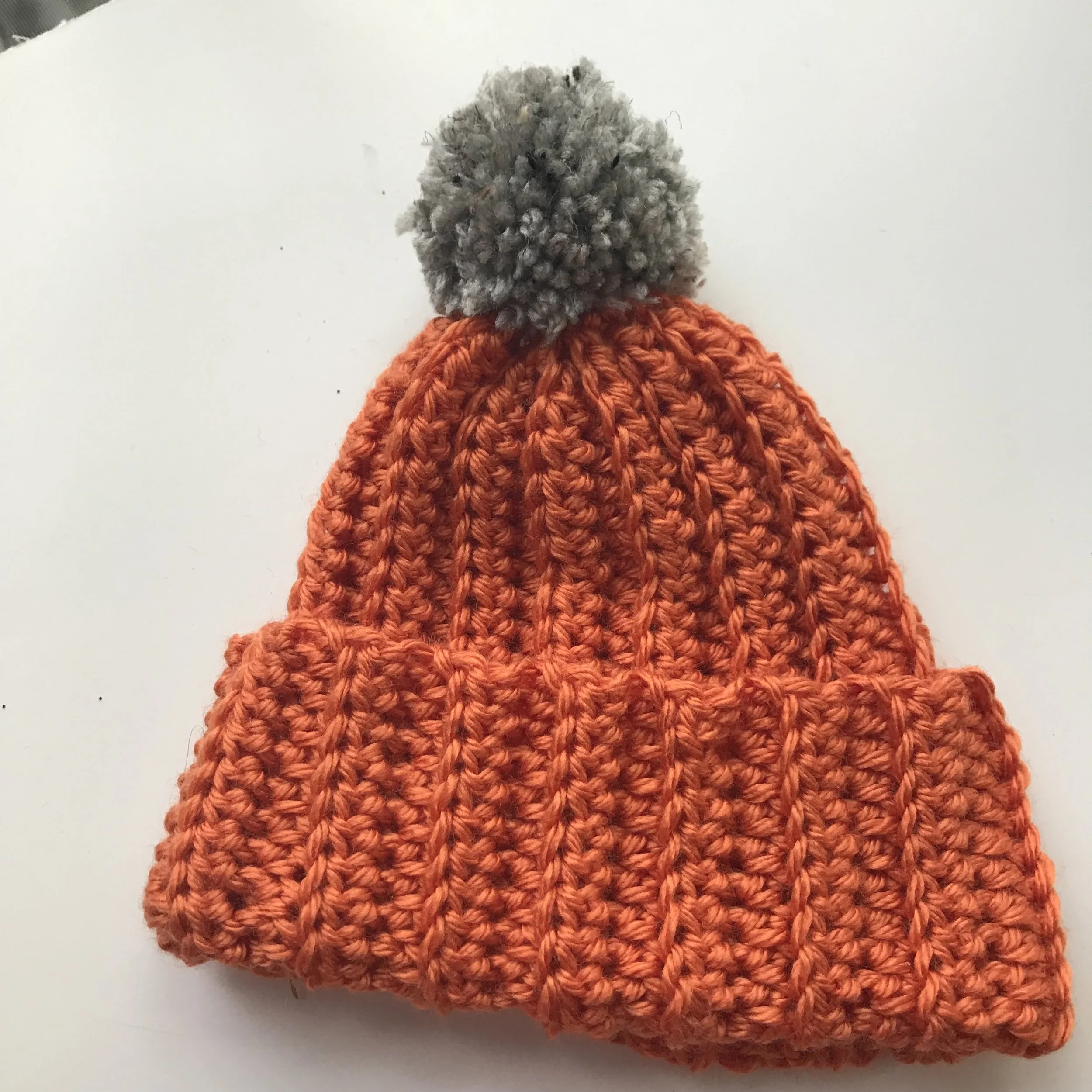 Orange Crochet Hat with Gray Pom Pom 