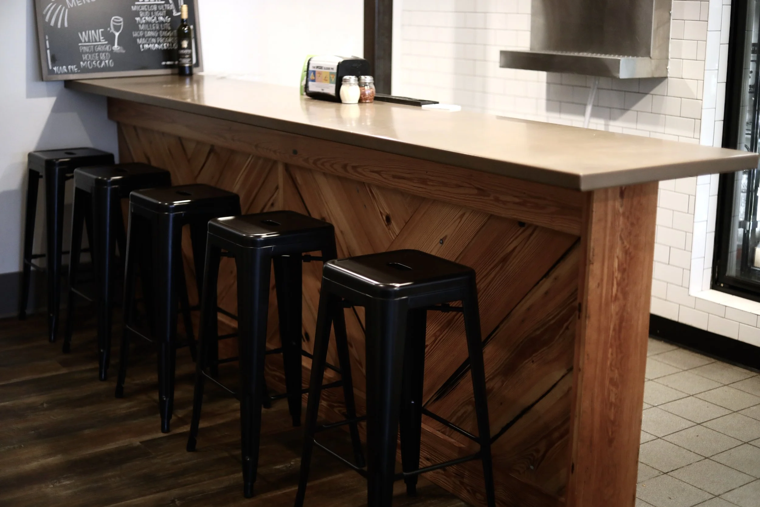 restaurant-bar-wood-front-black-stools.jpg