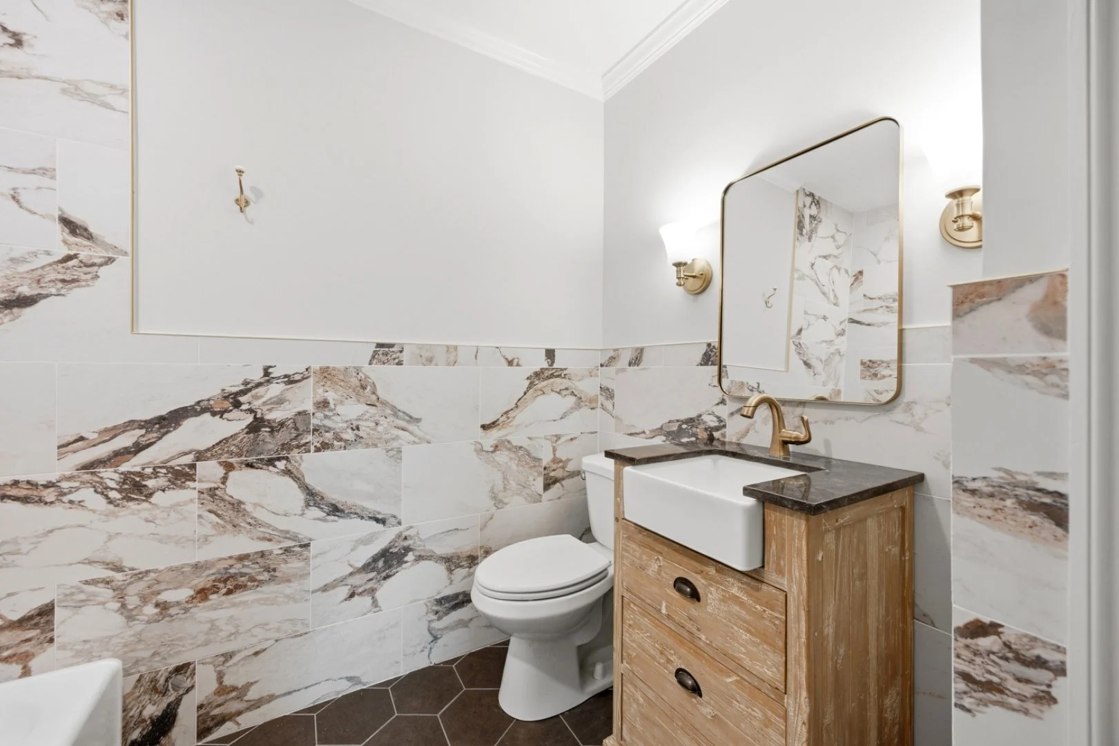 A handcrafted wood vanity brings warmth to this powder room.