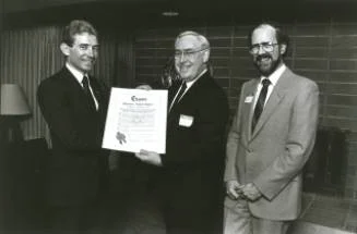 Jack Meredith (left) and Cedric Trueman (right) being presented with the Charter at the inaugural dinner in April of 1985.