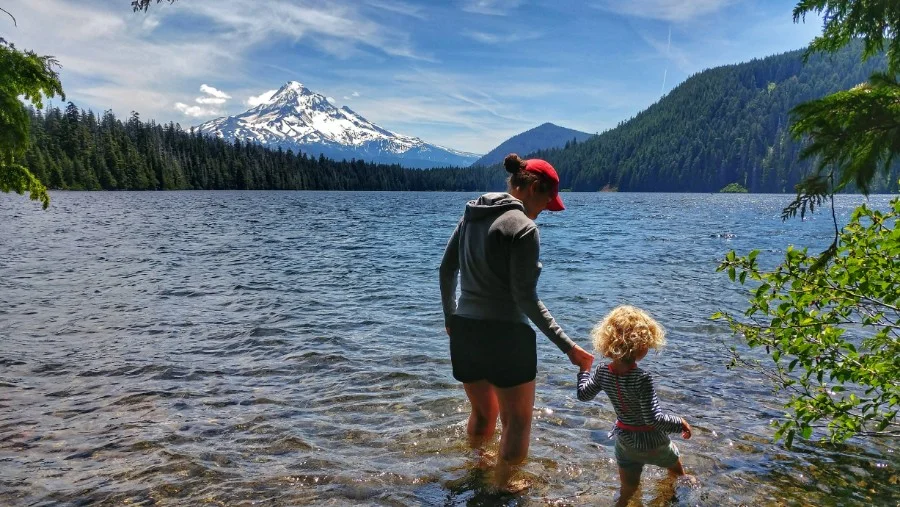 Dipping our toes in Lost Lake with Mt. Hood in the background.