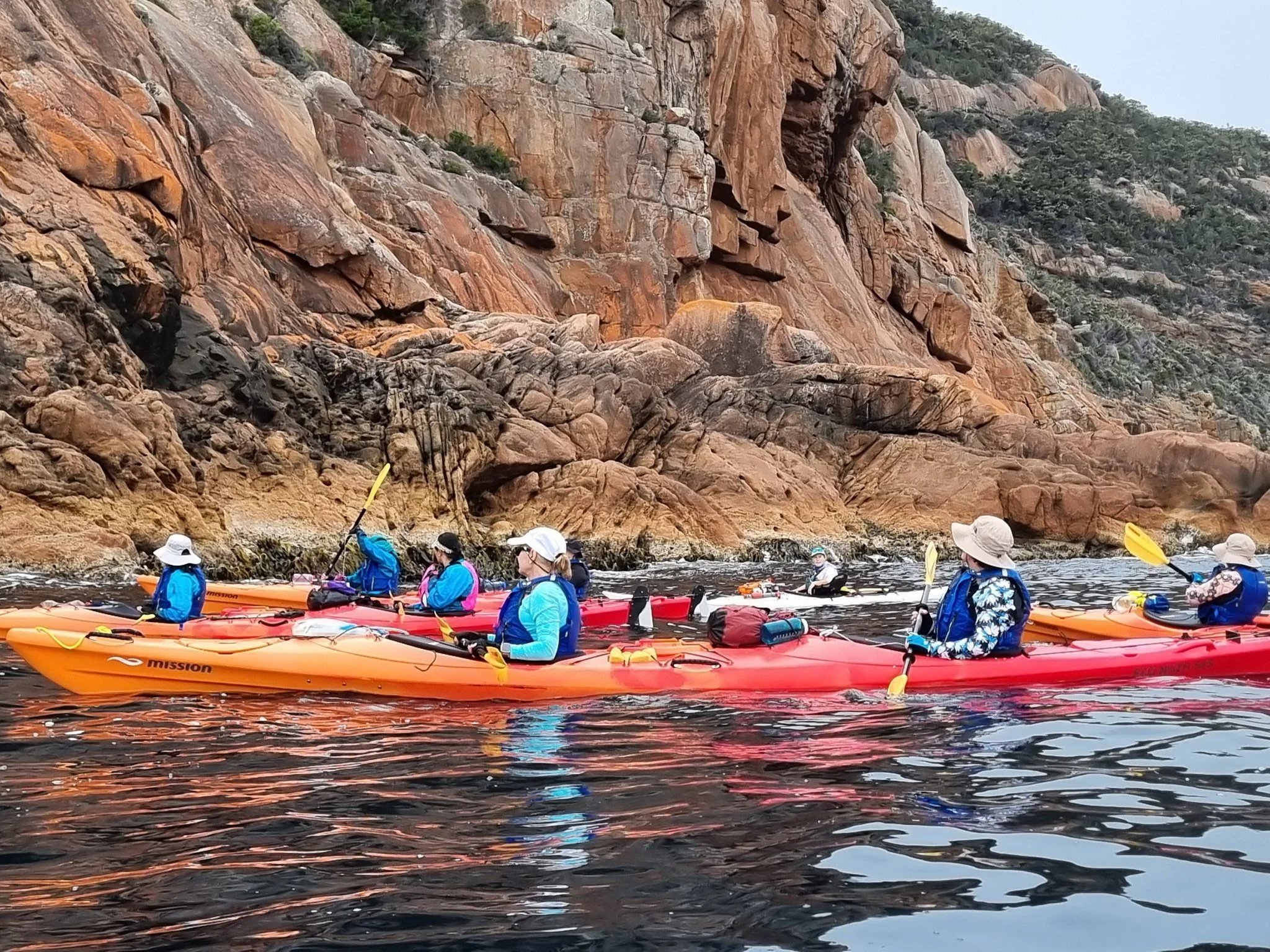 Freycinet kayak group photo looking at rocks.jpg