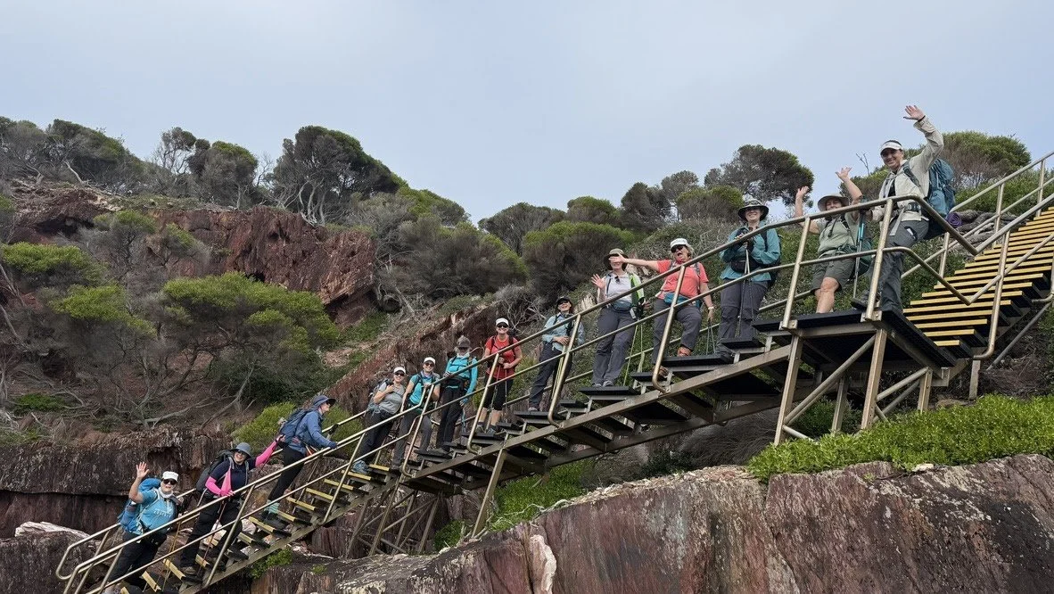 Group of hikers on Stairs on Light to Light hike