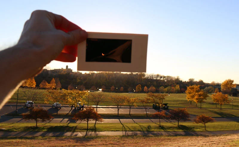 Figure 6-3: The image of a partially eclipsed Sun through a solar viewing card held at arm's length. Image credit: Tom Ruen/Wikipedia Commons.