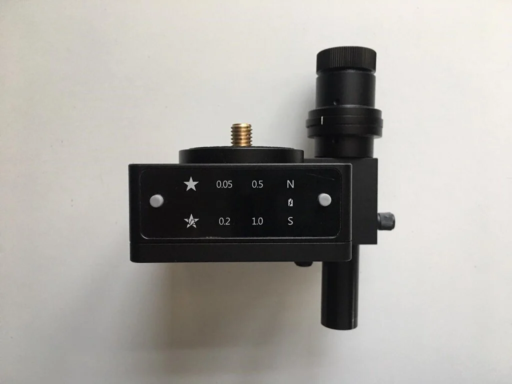 A view of the top side of the Sifo Rotator showing the 2 buttons, the various functions and the polar scope attached.