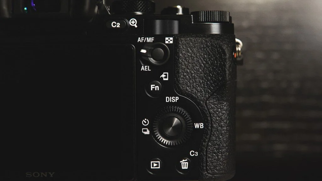 Switch your camera or lens to Manual Focus (MF).