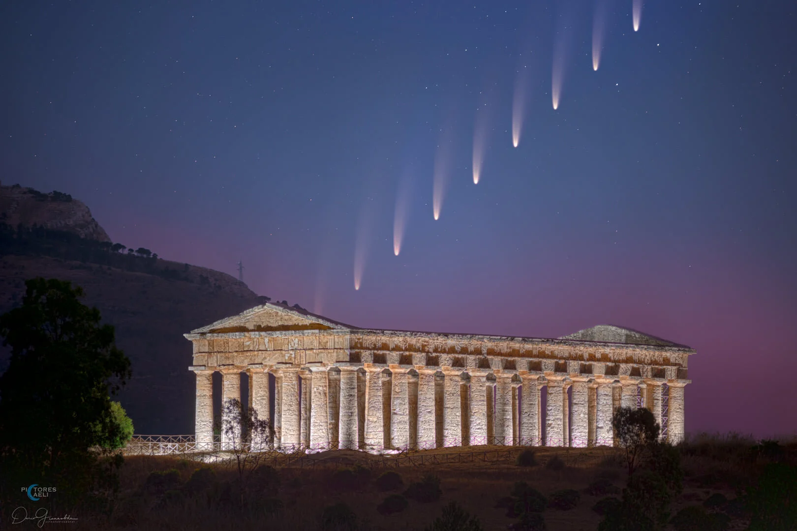 Comet Rising Over Segesta Temple - Italy  Blend, Stack  Once again the charm of some places in Sicily is indescribable... The Doric temple of Segesta emerges from the dark of the valley! A unique place without any modern inhabitants. Immersed in nat…