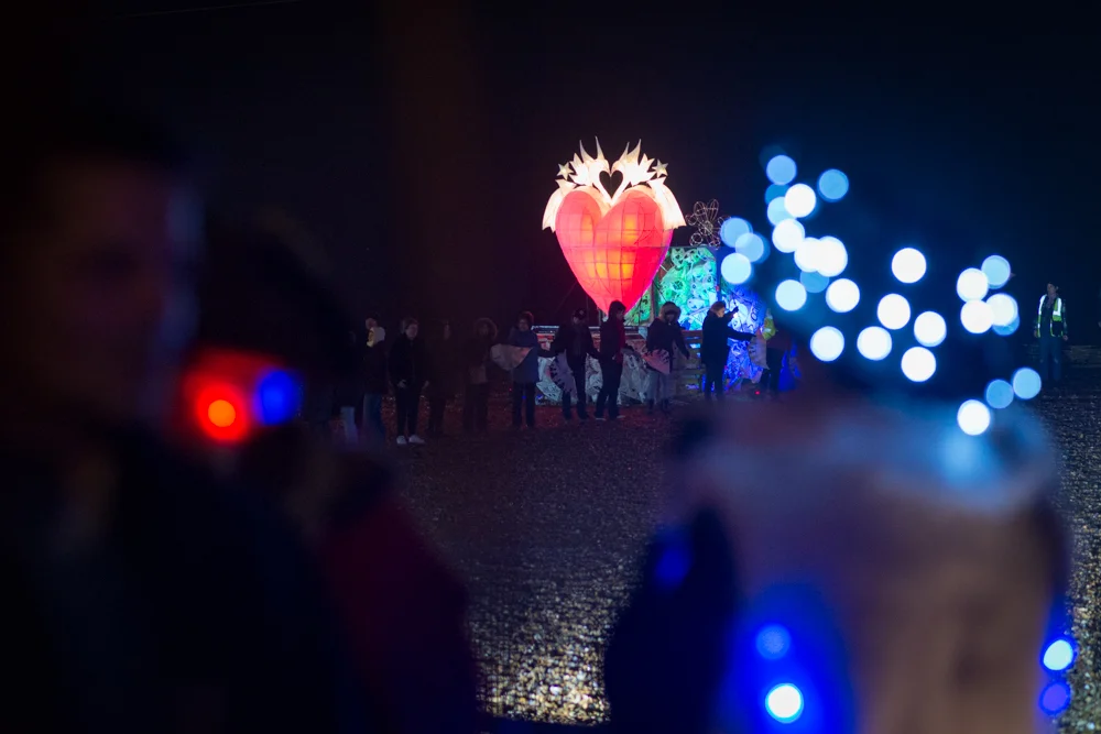 The bonfire being filled with lanterns