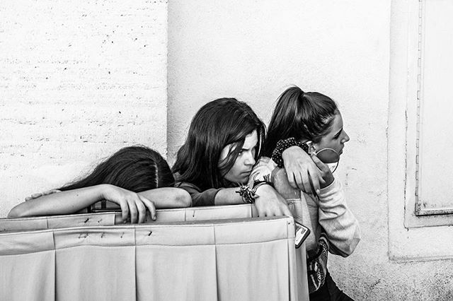 Tired teen tourists at Piazza San Pietro