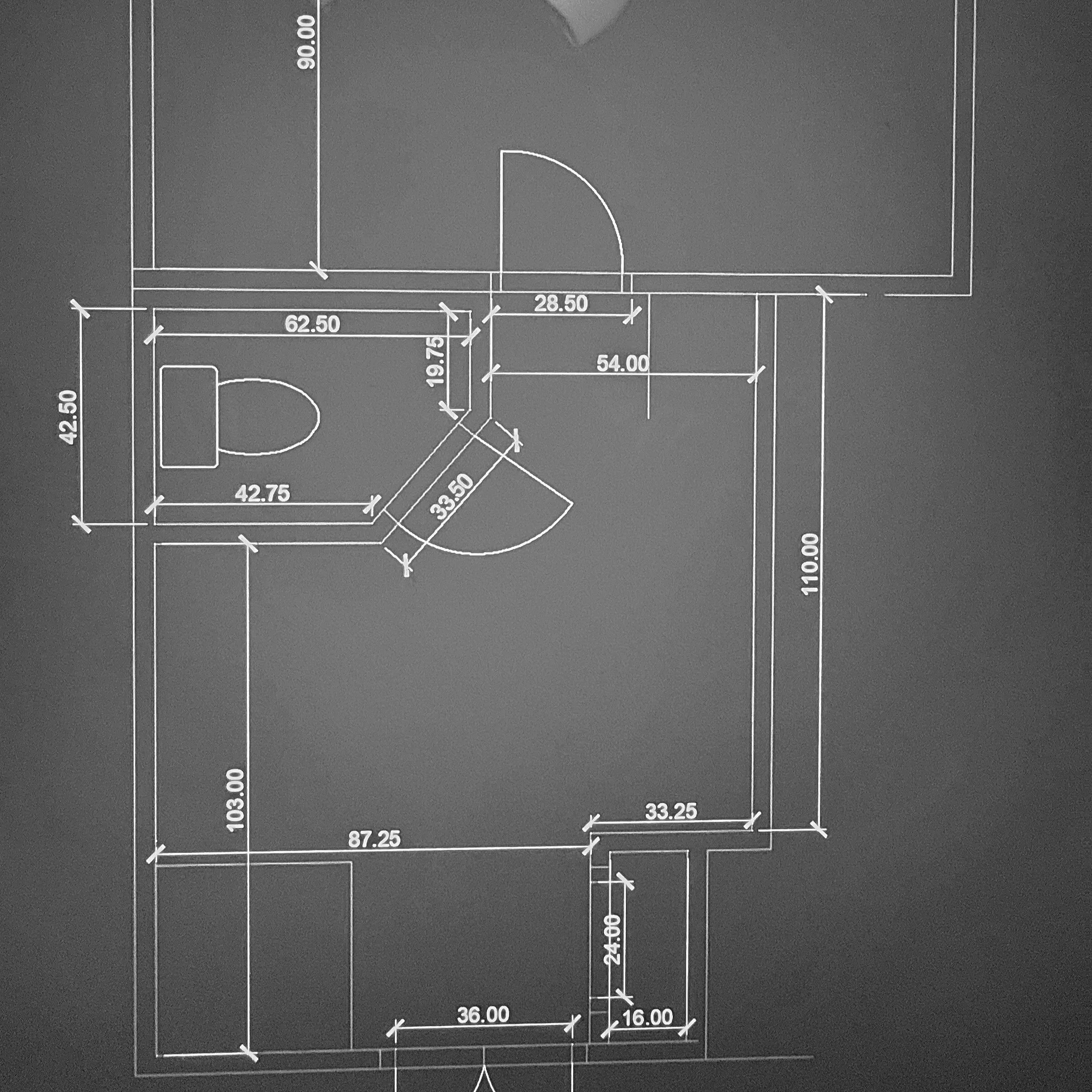 Blueprint of a room layout with measurements in inches, showing walls, a door, a window, and interior features.