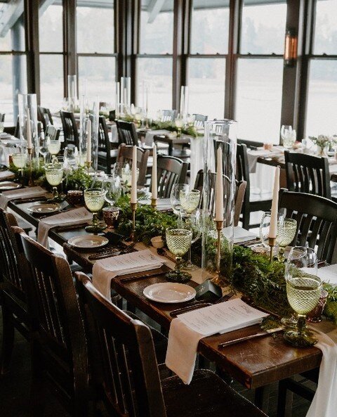 G&amp;M came to me with a vision for their decor that incorporated dark greens and copper to naturally complement the wood tones and gorgeous views of their venue.⁠
⁠
We achieved their vision by designing alternating table set ups with green garland,