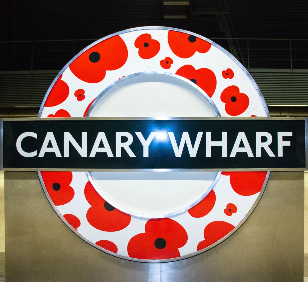 Remembrance Day marked by poppies on the Canary Wharf station signs