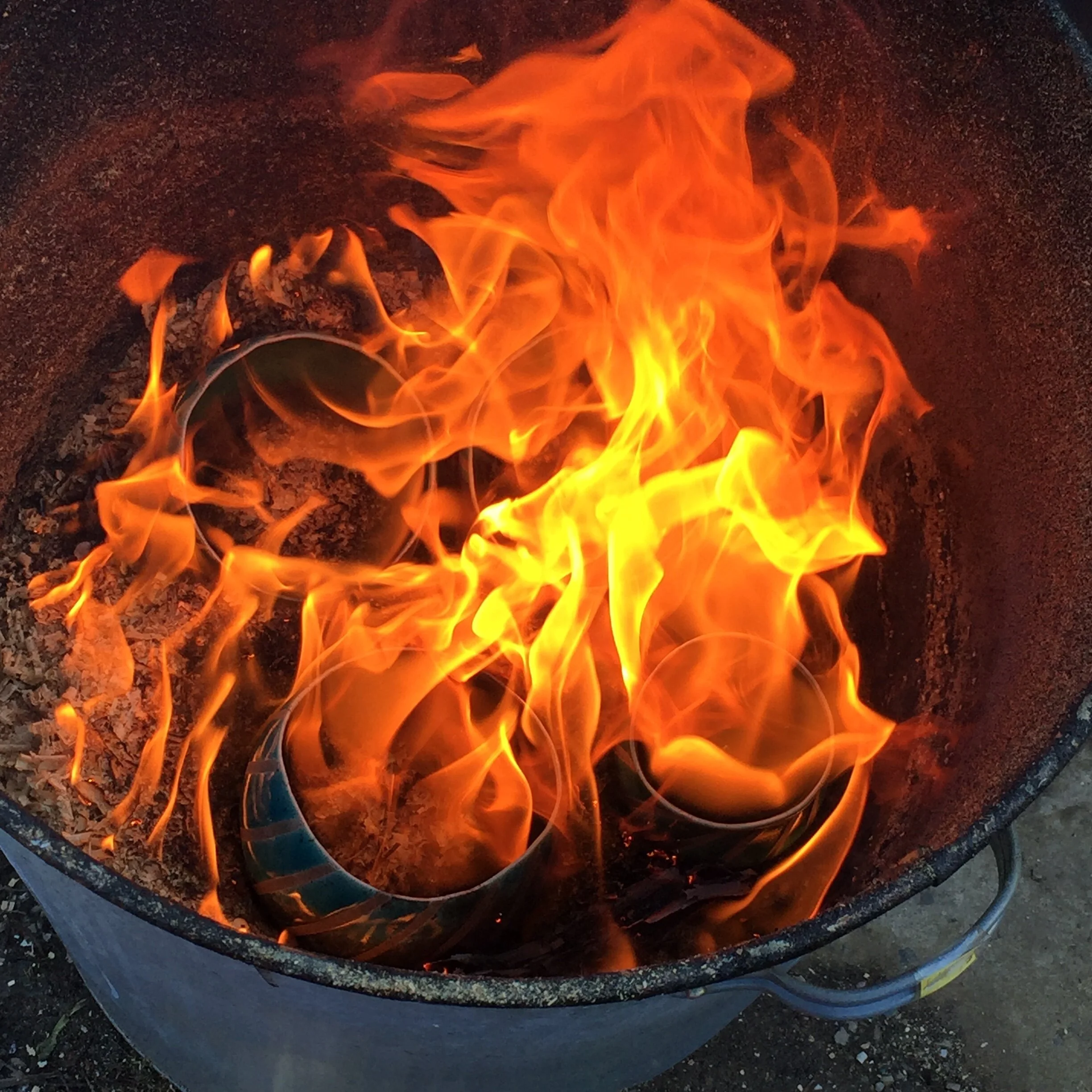 Firey stripey pots in sawdust.JPG