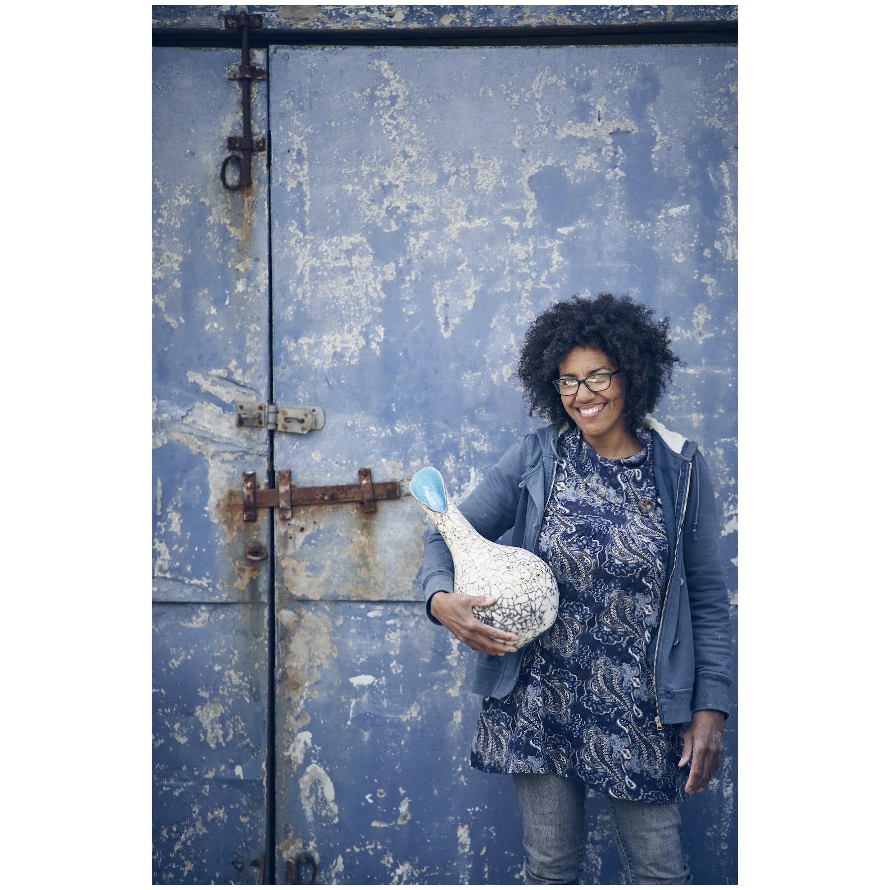 Catherine in front of studio door_Jesse Wild.jpg