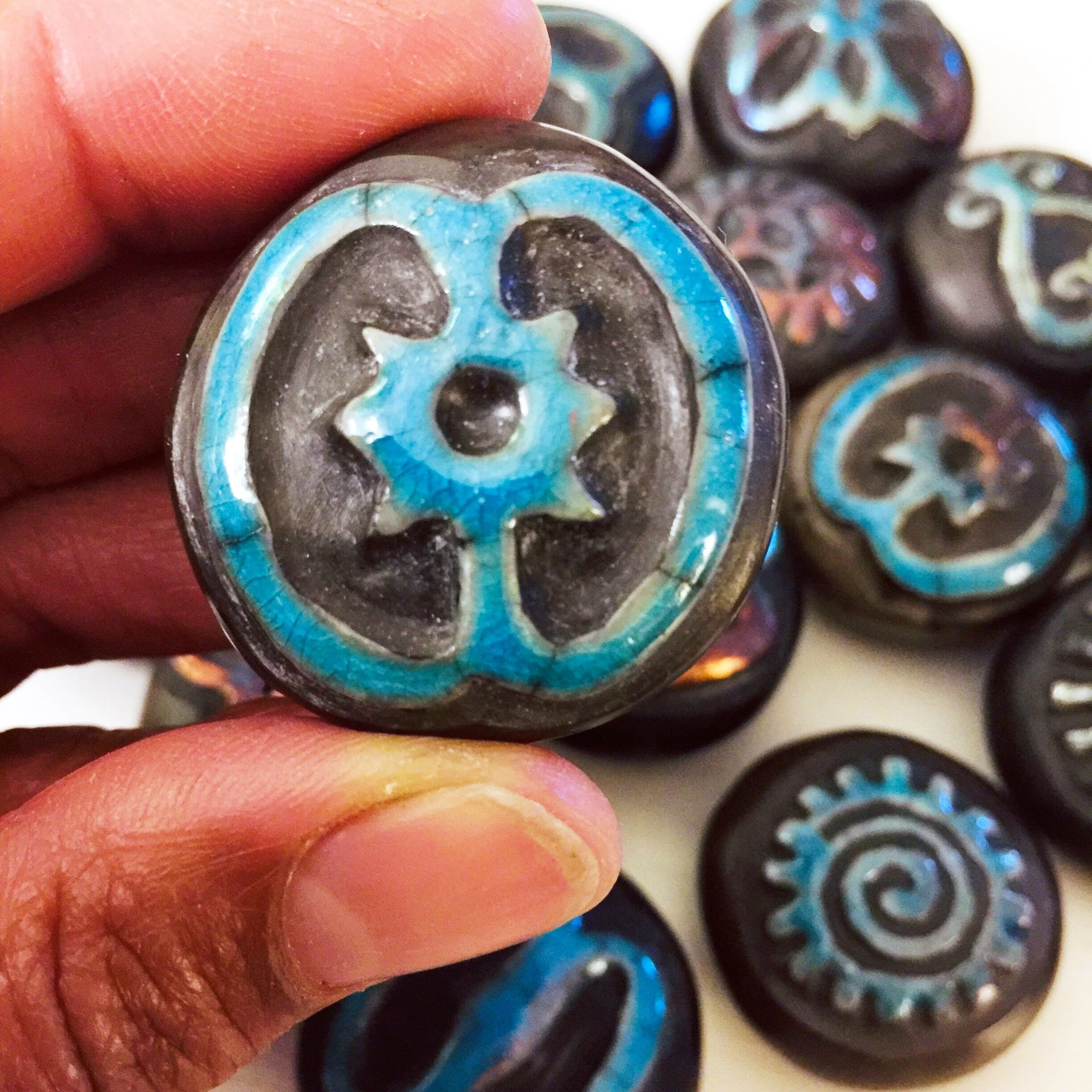 Adinkra stone in hand.JPG