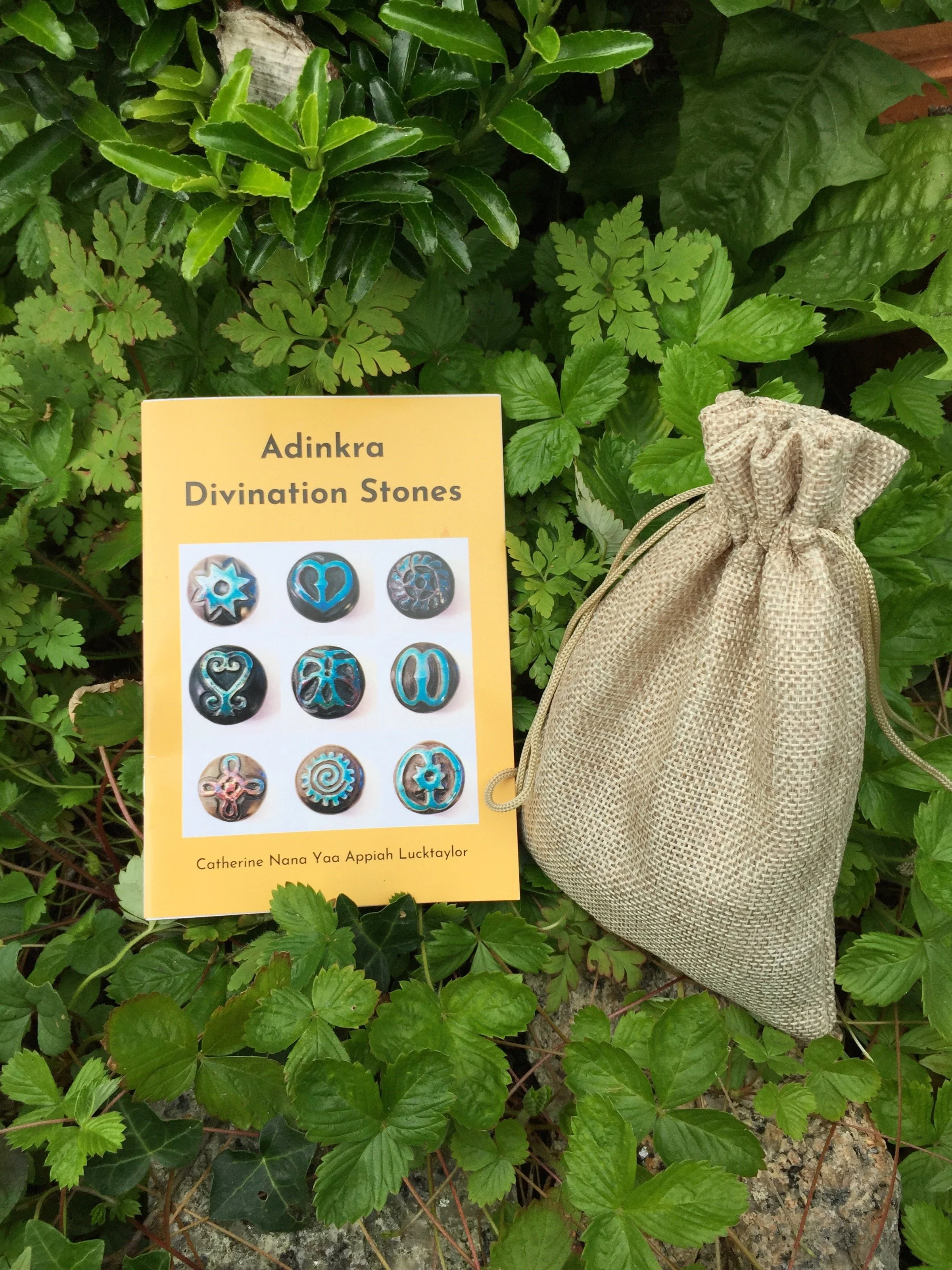 Adinkra Booklet and stones in bag.JPG
