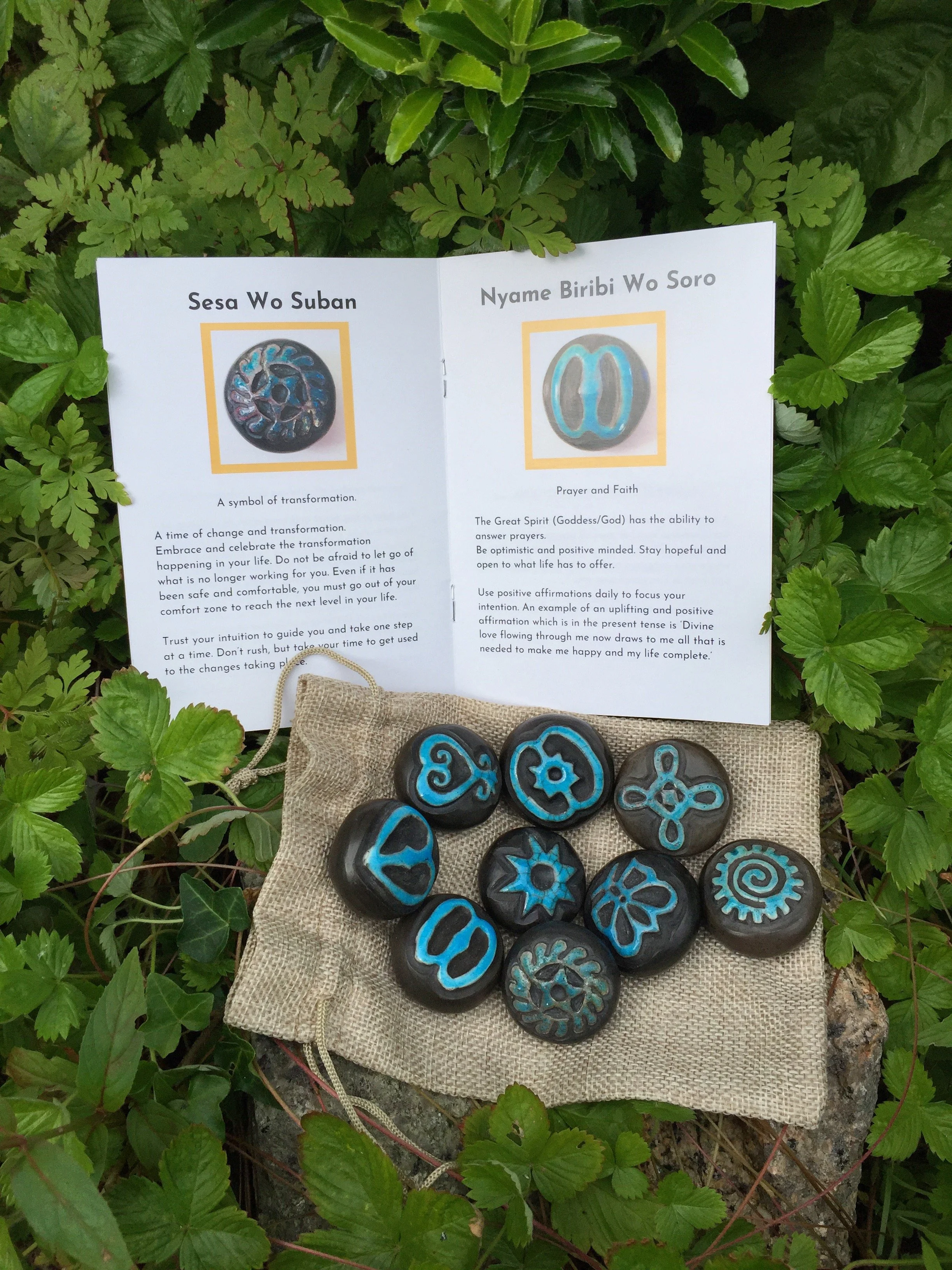 Adinkra stones and open booklet_Lucktaylor Ceramics.JPG