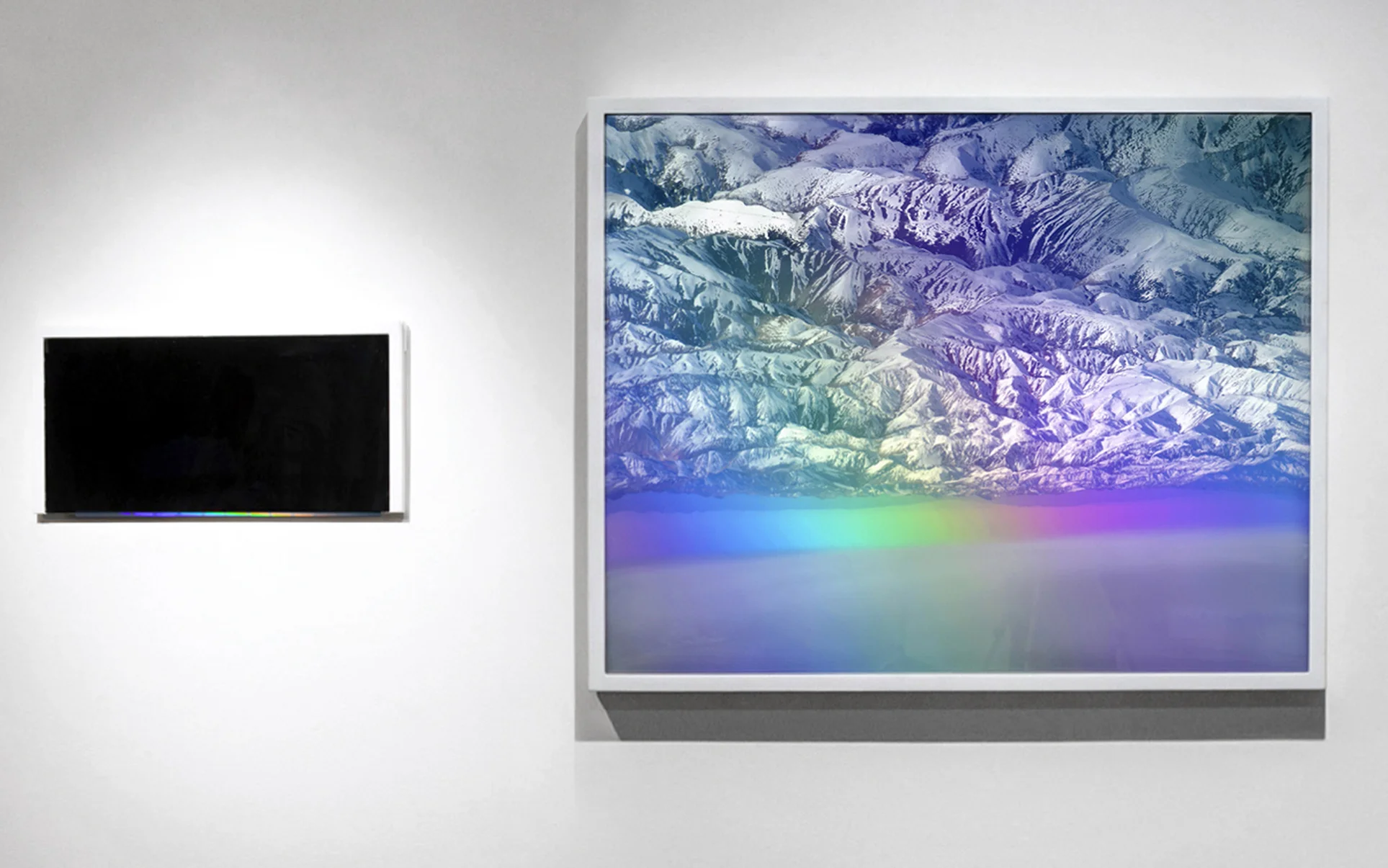 Horizon , 35” x 40” and 9” x 18”, Framed inkjet photograph, cut beveled mirror, light, reflection (spotlight creates a prism on the mirror bevel), 2012. Collaboration with Carlos Vela Prado