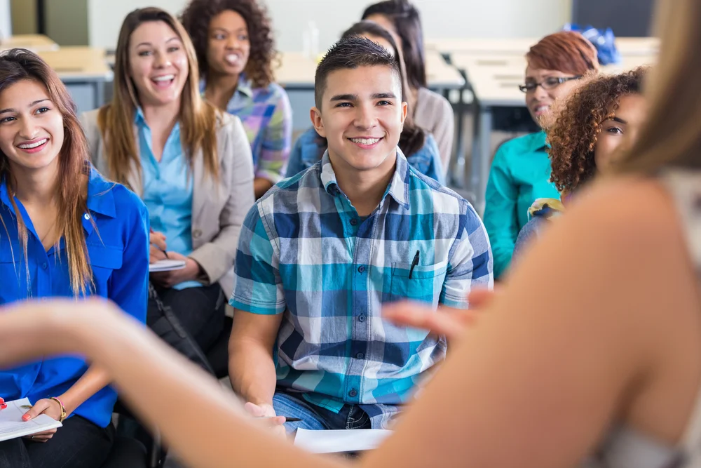 Young people listening in a classroom