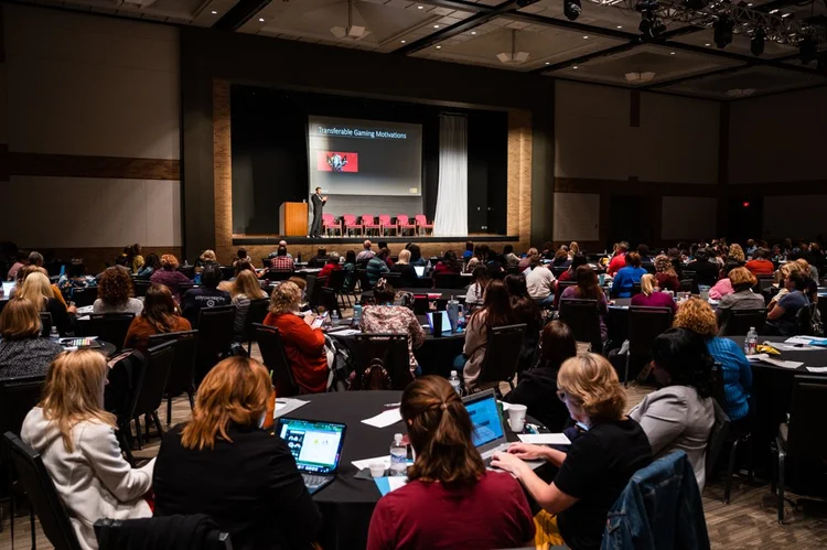 A full audience watches a presentation at When Life Hands You Teenagers
