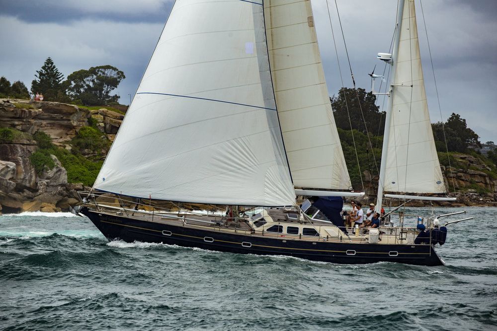 Steel Sailboats: The Steel Sapphire, a steel sailboat next to shore