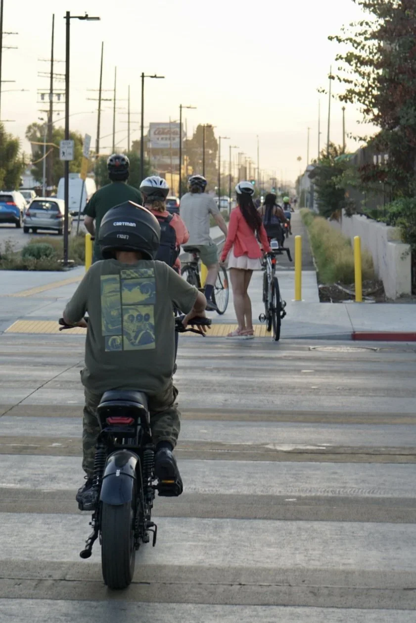 Community members gather in South LA for a group ride along Slauson from the metro A line to the metro K line.
