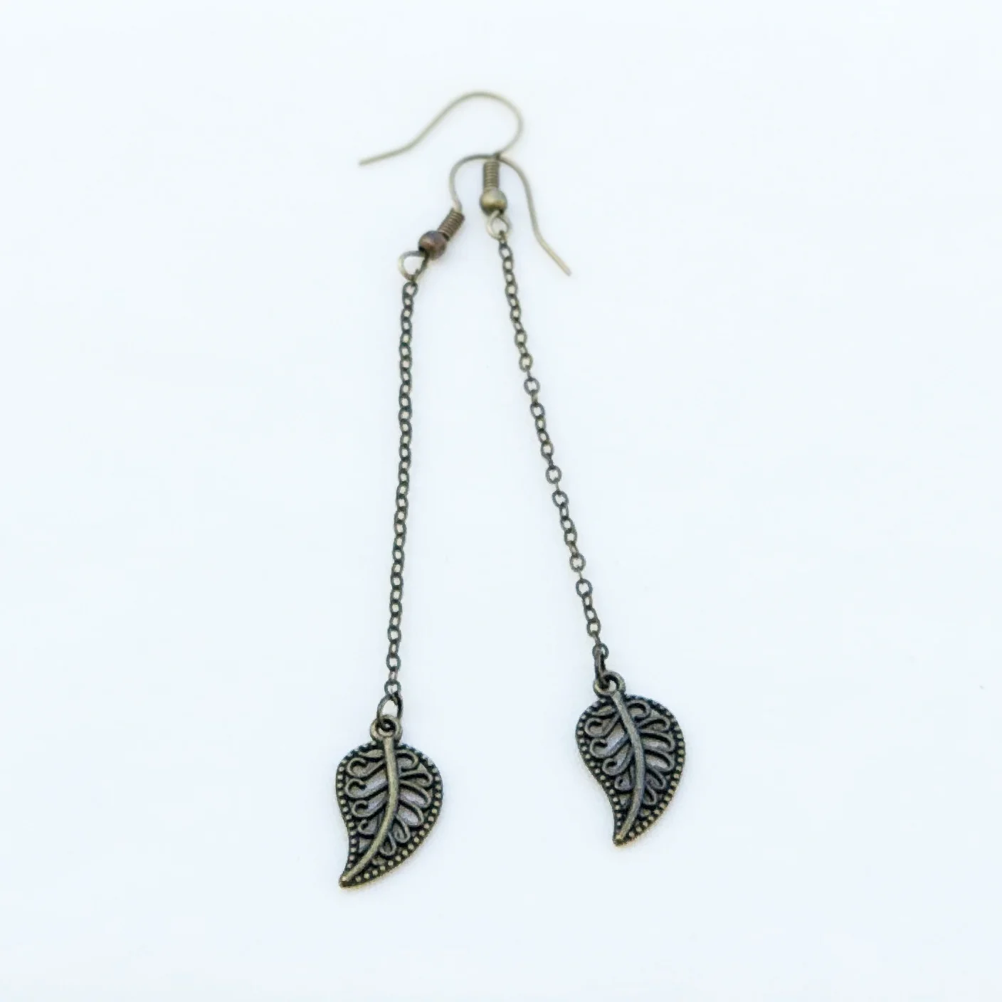 Antique gold X-ray leaf drop earrings.jpg