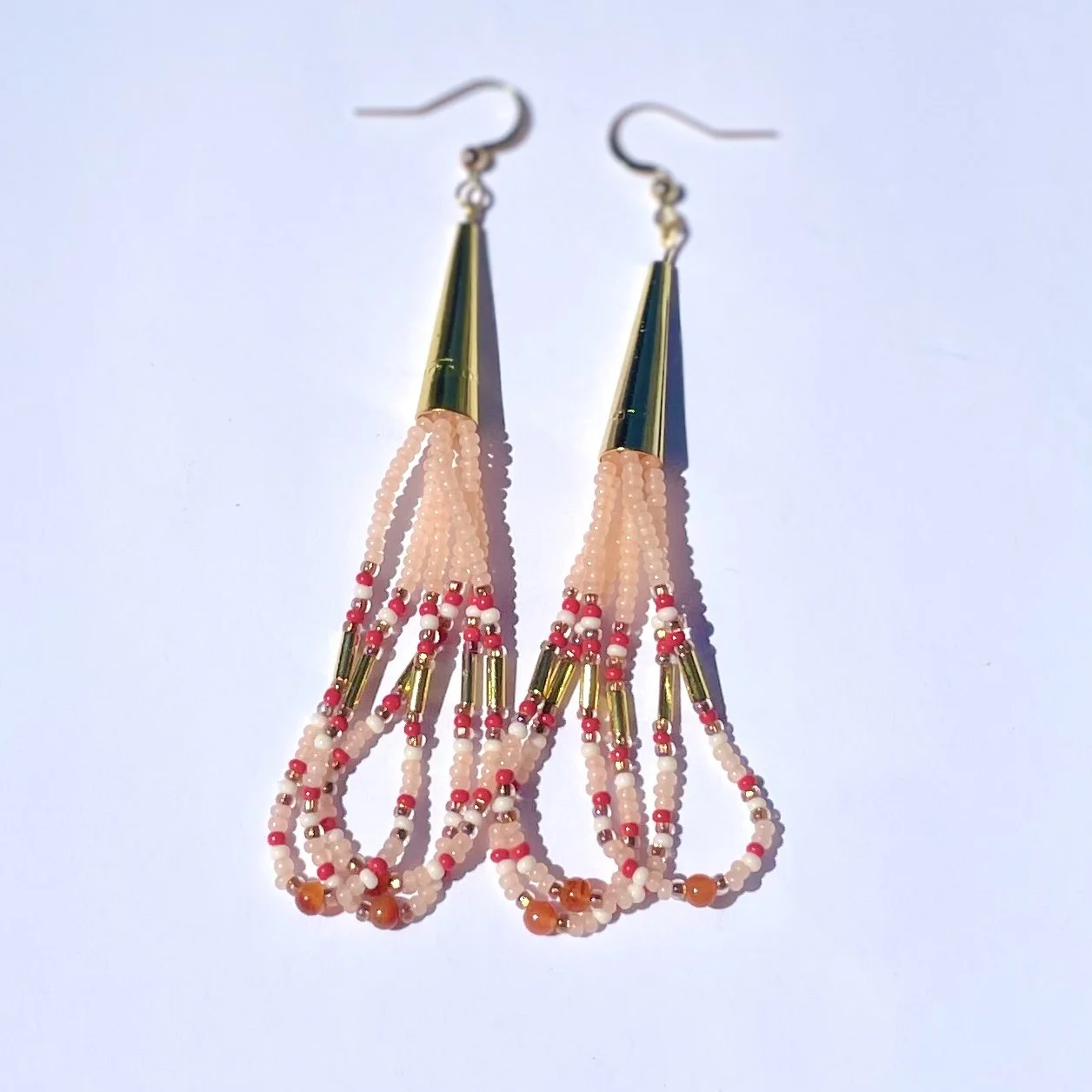 Pale orange and gold loop earrings