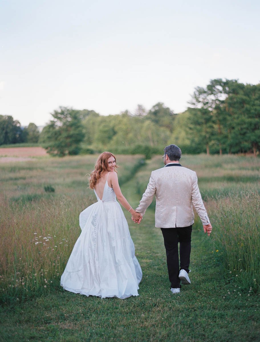 Couple-Running-Field-The-Maples-Estate.jpg