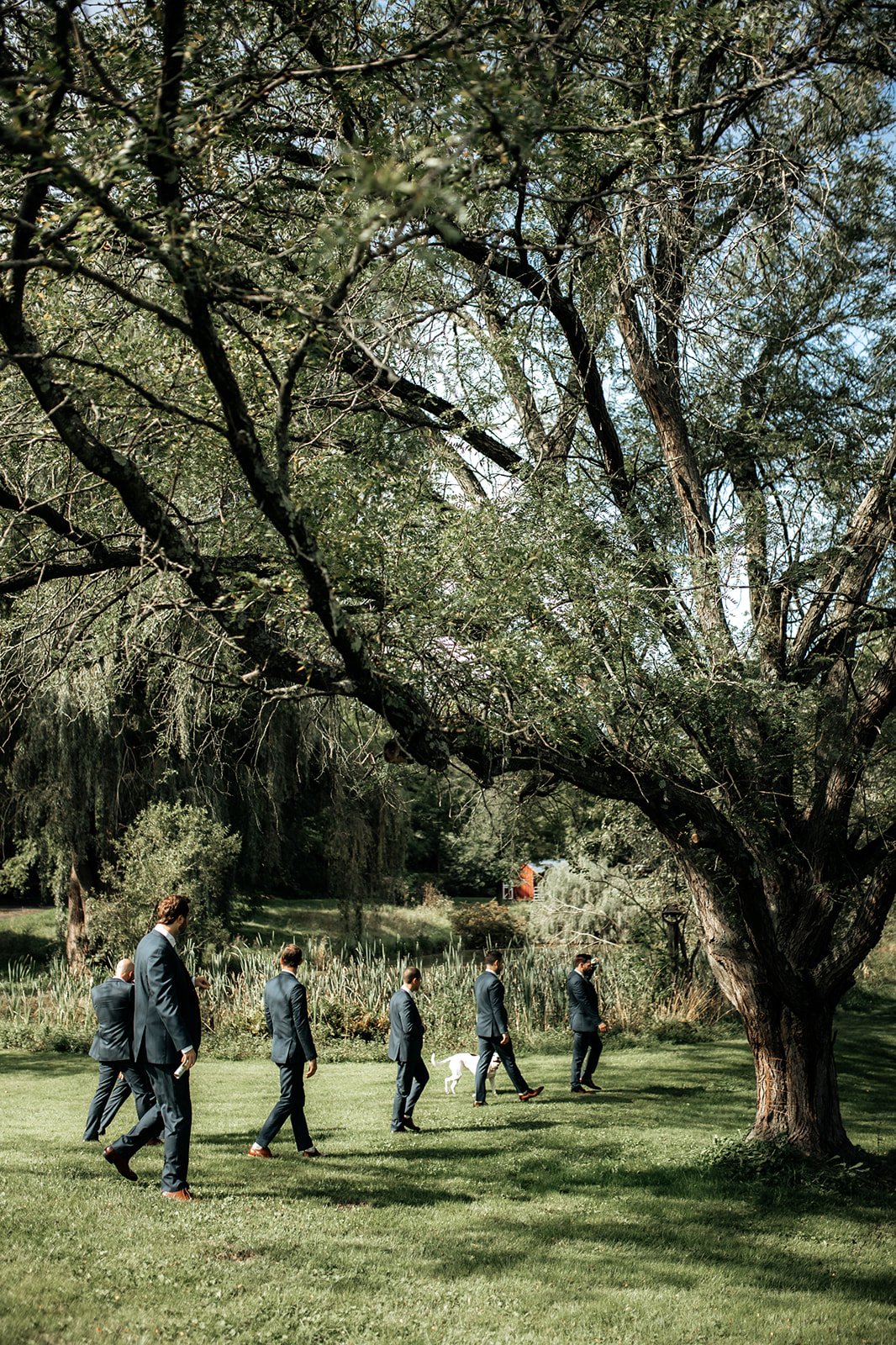 Romantic_Upstate_NY_Wedding_32_groomsmen_walking.jpg