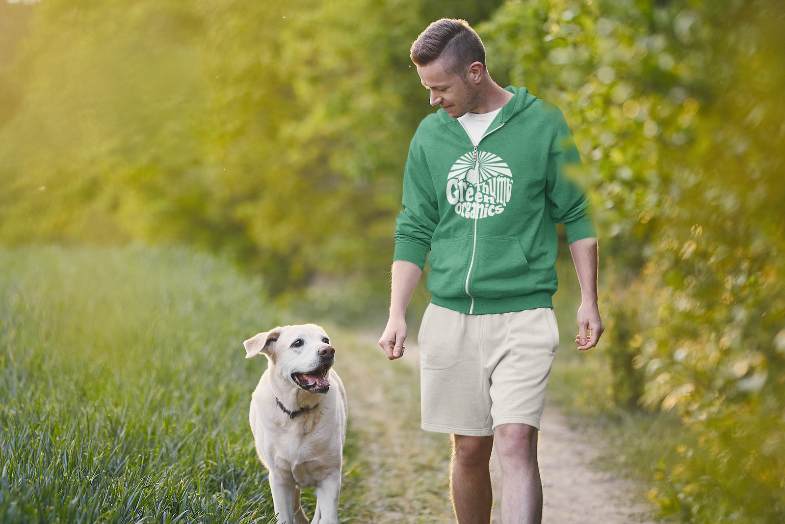 602d9c7a42a61302ec8dc57d_hoodie-mockup-of-a-man-walking-with-his-dog-in-the-park-42924-r-el2.png