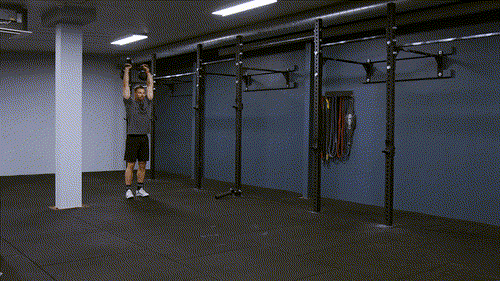 Double overhead kettlebell carry