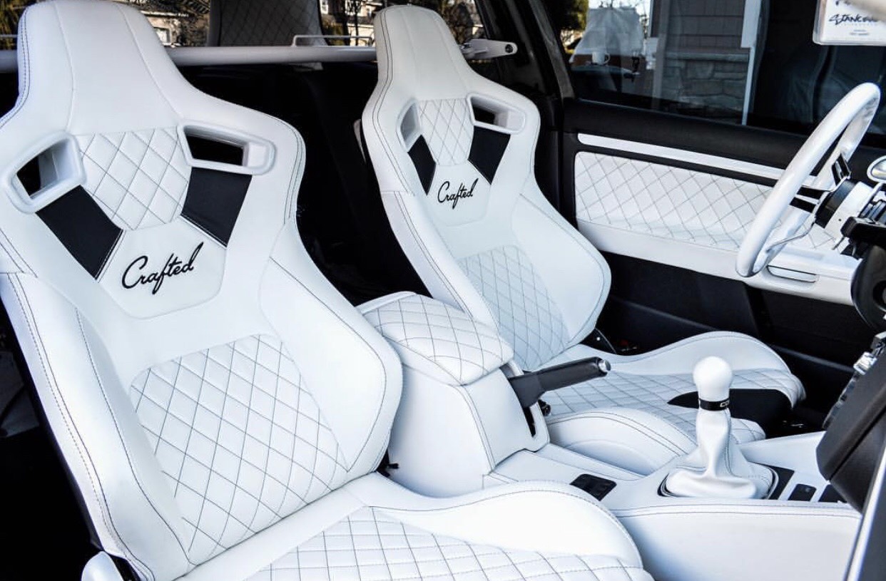 NW Crafted custom white on white leather racing seats with high quality Alcantara suede and diamond stitched accents. Matching console, door panels, leather wrapped steering wheel, and shift boot.