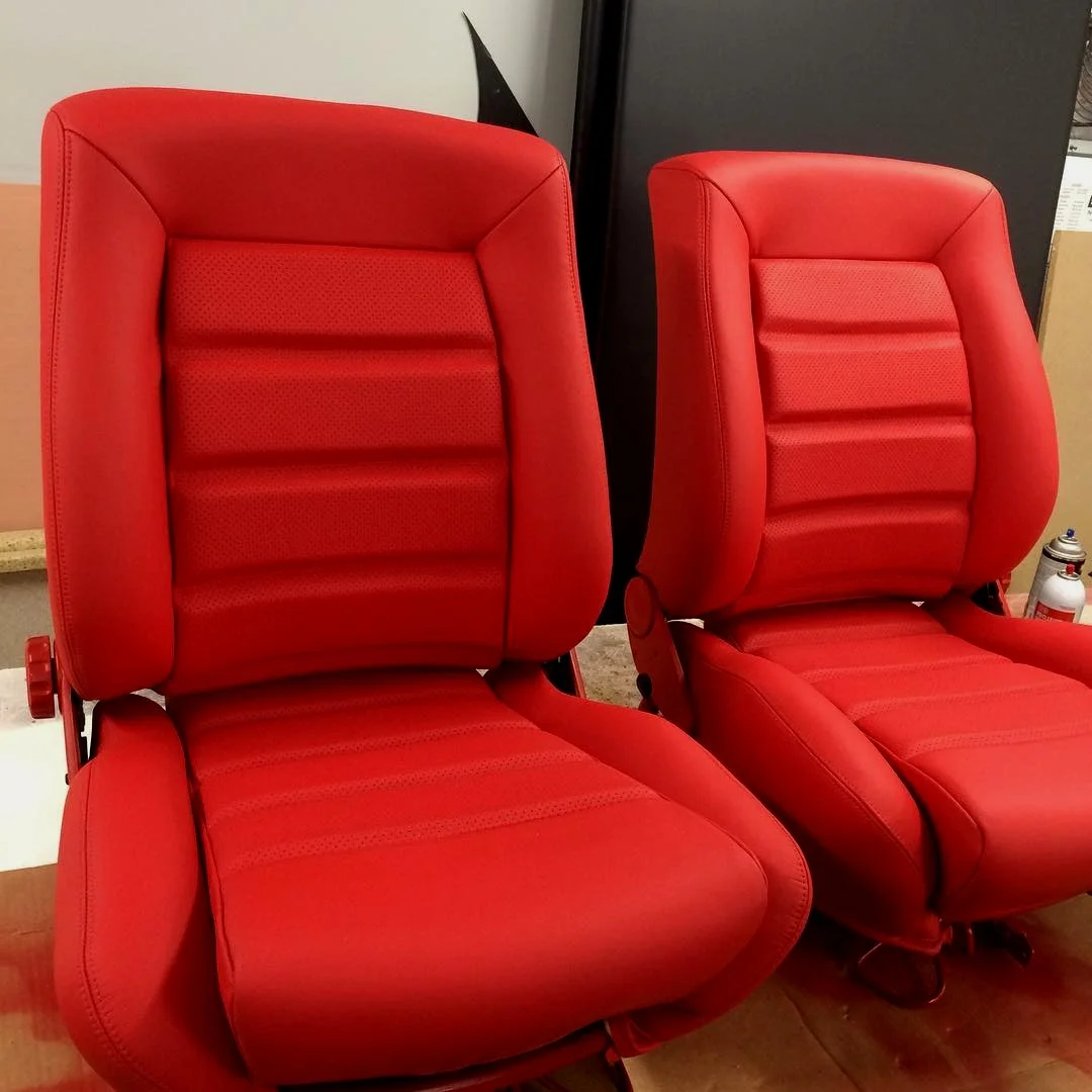 Custom red leather bucket seats