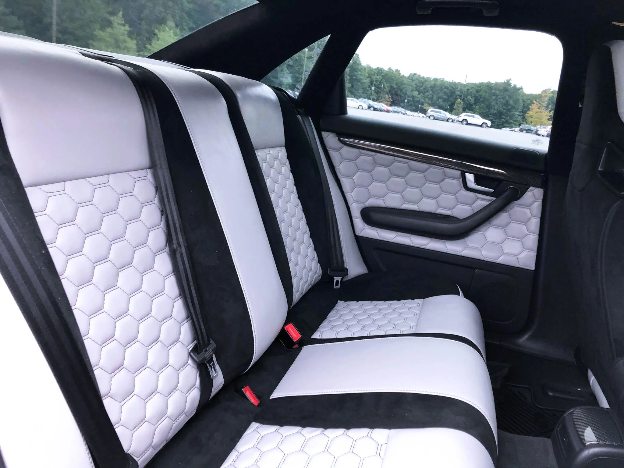 2006 Audi S4 - Full custom interior with hexagon stitching and black micro suede seats and door panels.