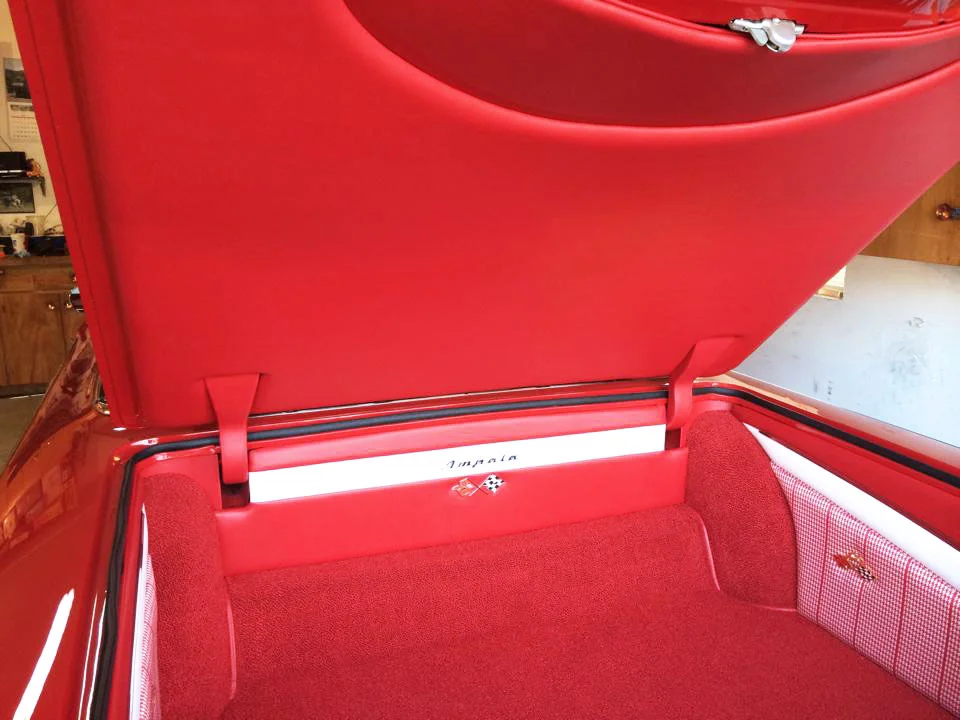 Impala complete interior restoration. Red and white trunk carpet and lining.