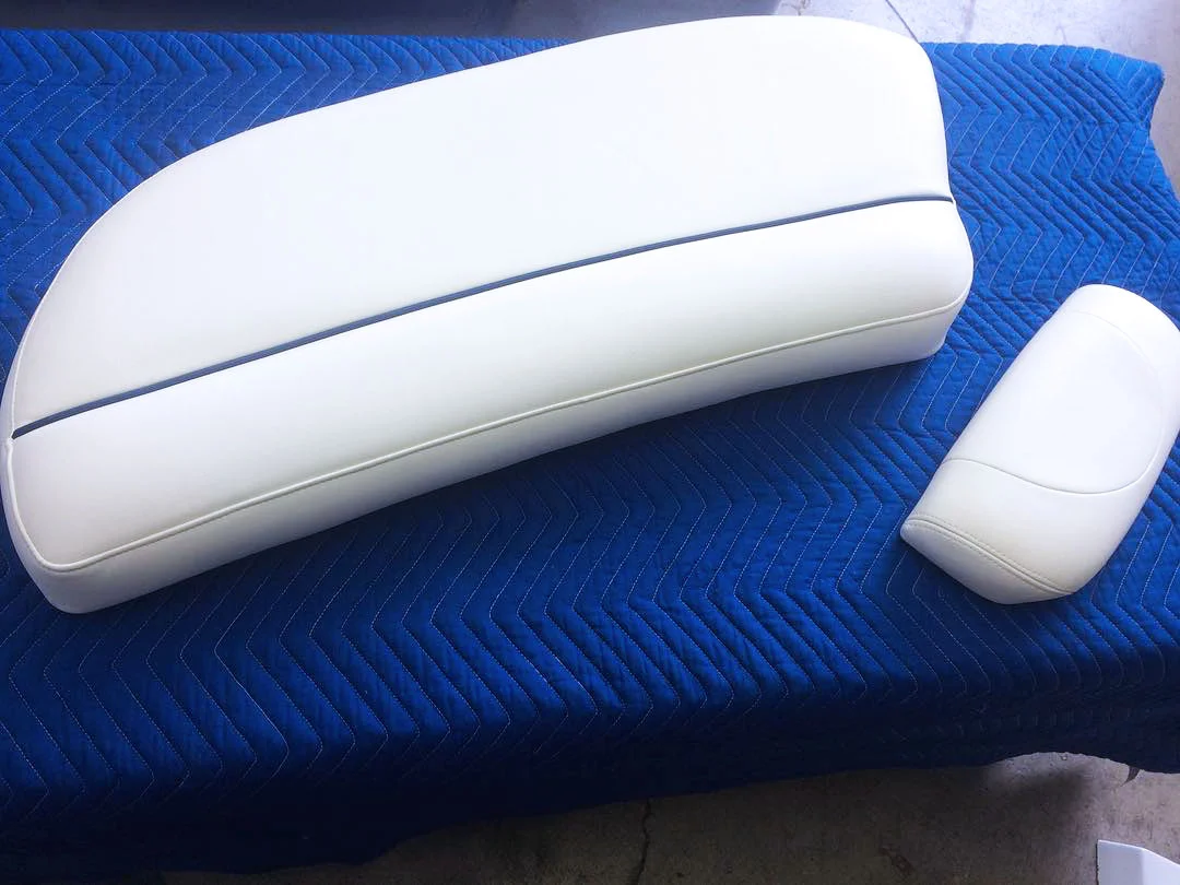 Custom boat interiors. White and blue lined leather.