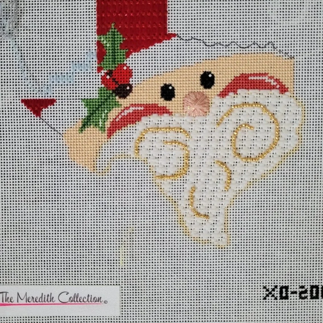in progress needlepoint work depecting a santa in the shape of Texas by "The Meredith Collection"