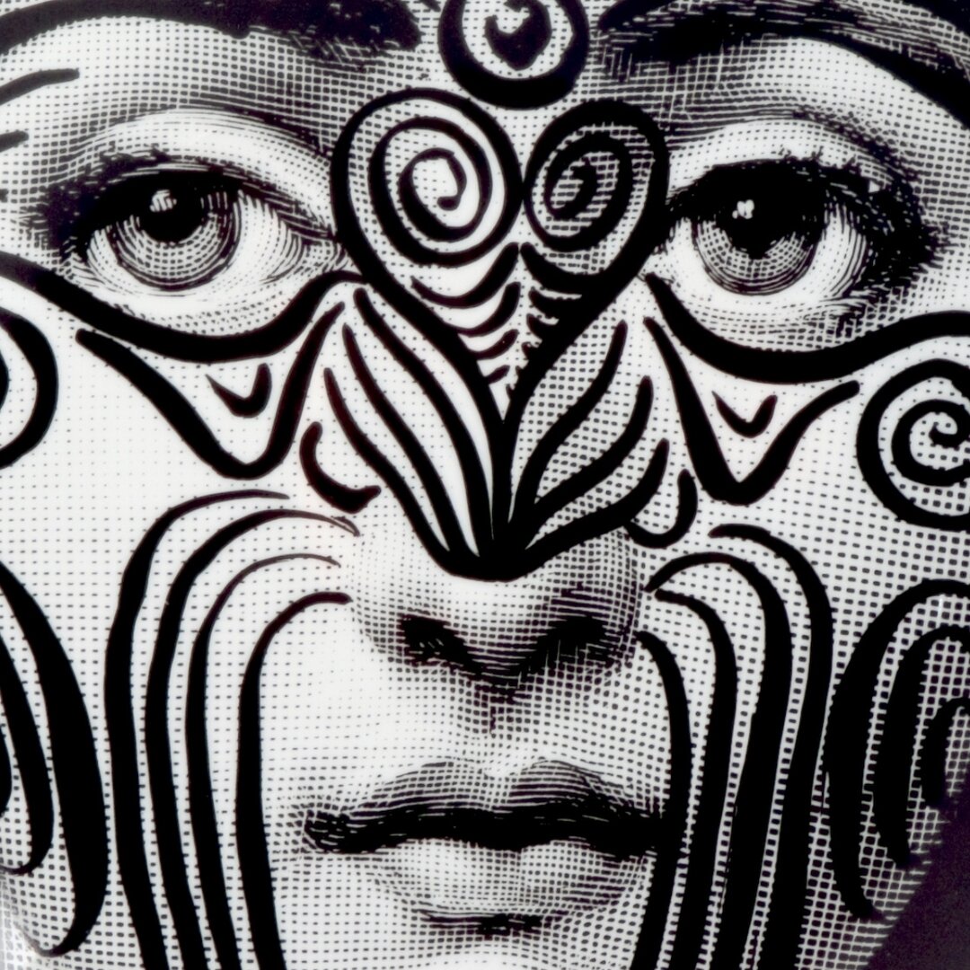 Plate No.09

The enigmatic face of Lina Cavalieri with the markings of the traditional Māori tattoo, Ta Moko. Black and white ceramic wall plate designed by Piero Fornasetti and made in Italy using exclusive techniques. 

Only 2 Pieces available. 

#