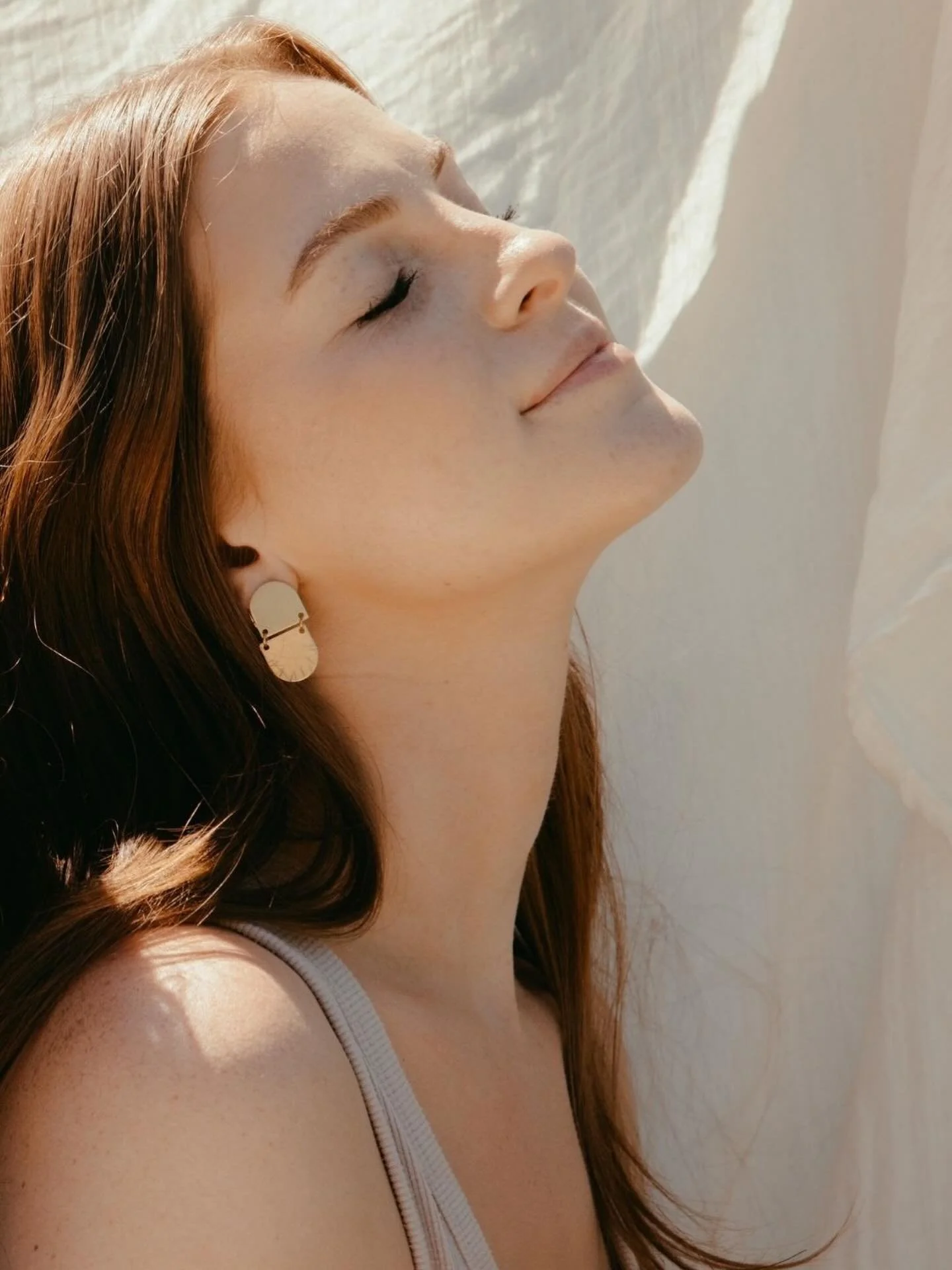 When that March temp reaches 60, the sun shines on your face and you don&rsquo;t have to put on a hat, suddenly anything feels possible. 

Gillian modeling the Arka Earrings here. Brass body, hand stamped design and stainless steel post. www.foundand